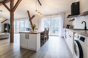 Fridge, stovetop, dishwasher, coffee/tea maker