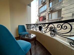 Deluxe Quadruple Room, Balcony, City View | Terrace/patio