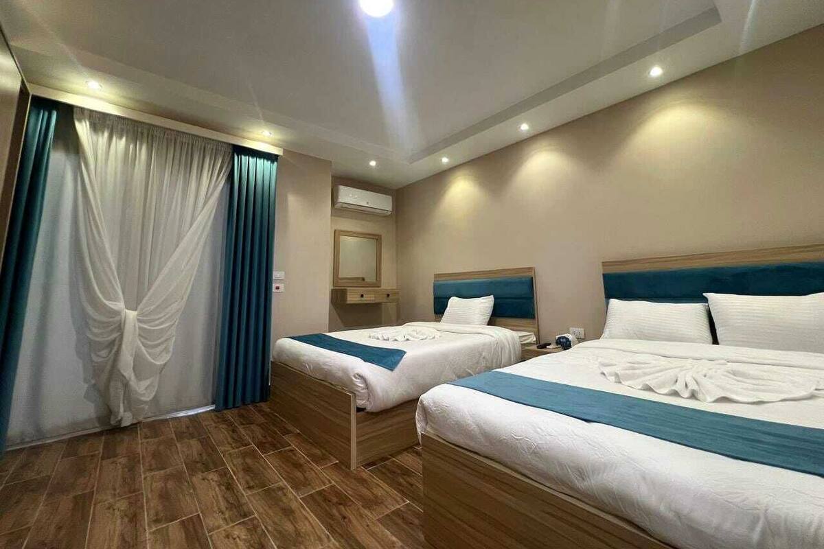Deluxe Quadruple Room, Balcony, City View | Desk, iron/ironing board, free WiFi