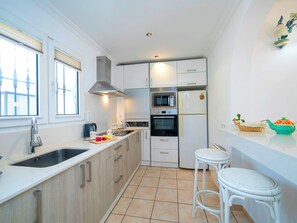 Fridge, microwave, cookware/dishes/utensils