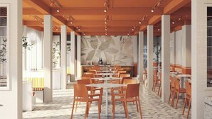 A spacious restaurant with high ceilings, modern lighting, and a central dining area with tables and chairs. - The Signature Retreat & Pool Phu Quoc (Phu Quoc)