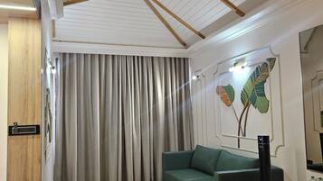 Superior Studio Suite | Living area | 42-inch LED TV with digital channels