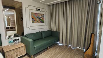 Premium Studio Suite | Living area | 42-inch LED TV with digital channels
