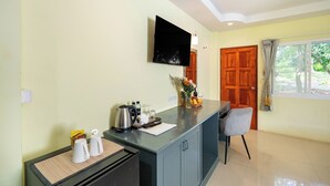 A clean, well-lit kitchen area with a coffee maker, tea kettle, and a fruit basket on the counter. - Oceanview Bungalows by EAT, Karon Beach (Karon)