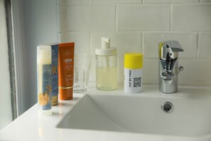Eco-friendly toiletries, hair dryer, towels