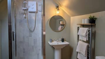 Shower, towels, soap, toilet paper