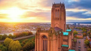 A large church with a tall tower, surrounded by residential buildings and a river. - Apt 4,34 Wood street (Liverpool)