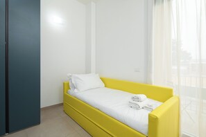 Family Quadruple Room, Balcony | In-room safe, blackout curtains, free WiFi