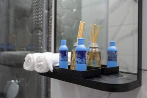 Shower, hair dryer, towels, soap