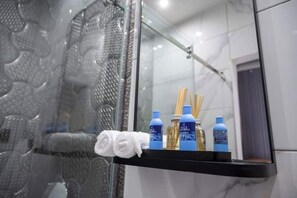 Shower, hair dryer, towels, soap