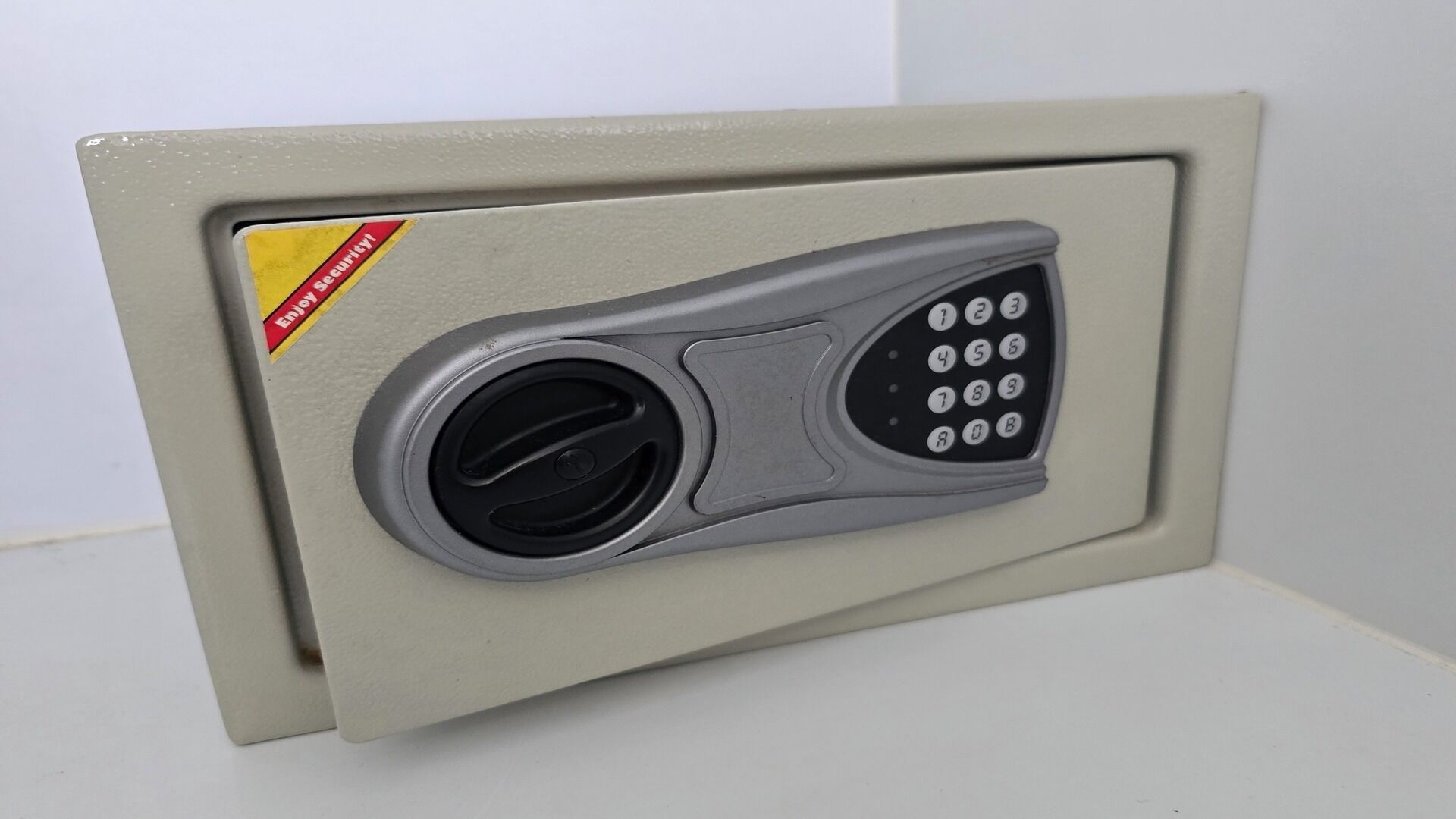A secure deposit box with a keypad lock.