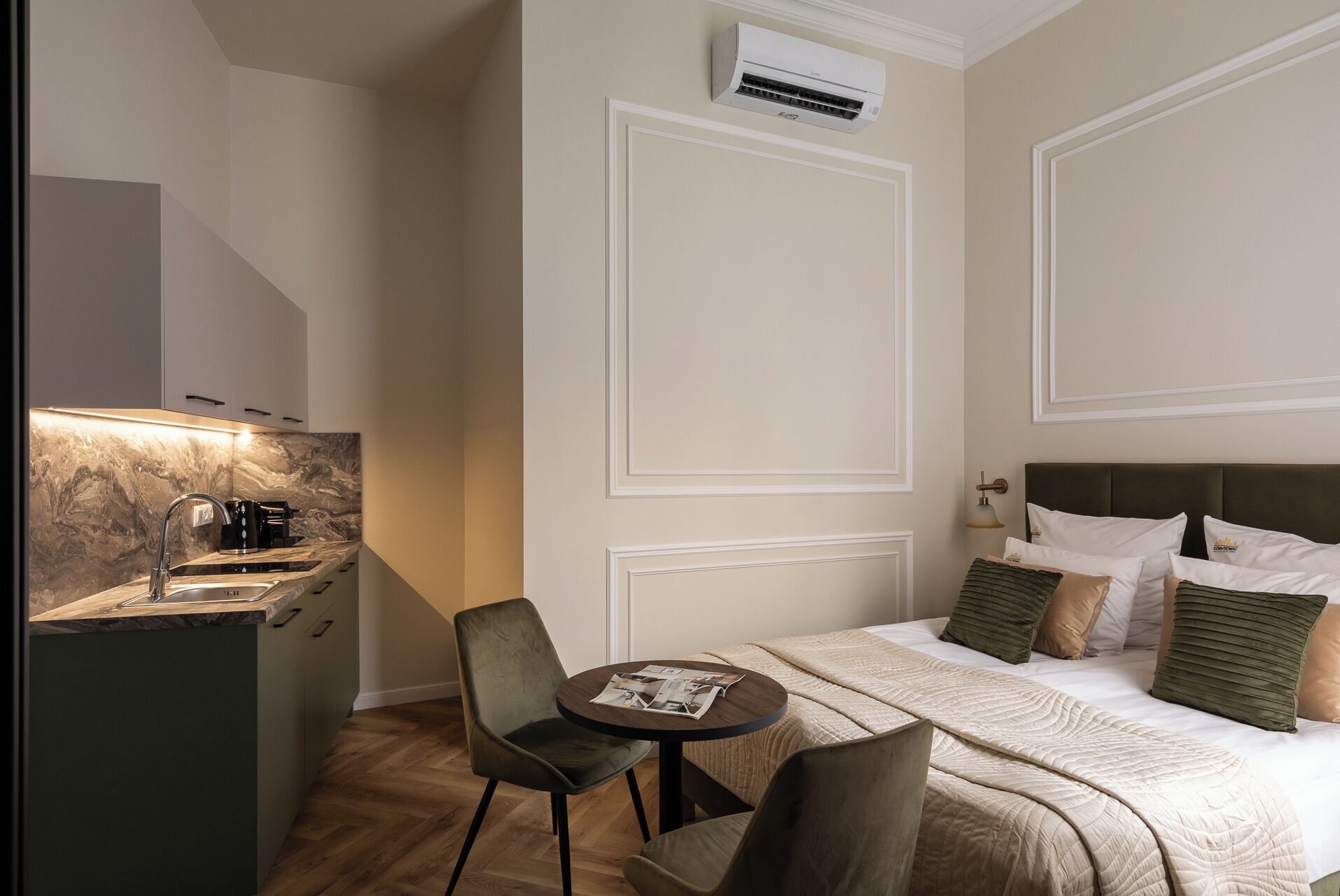 Deluxe Studio Suite | Living area | 35-inch flat-screen TV with cable channels