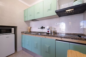Fridge, microwave, stovetop, coffee/tea maker