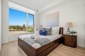 1 bedroom, desk, iron/ironing board, travel crib