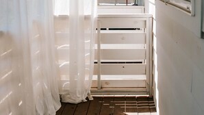 A narrow wooden corridor with a wooden bench and a window on the right. - Mid-Term Discounts - Near Downtown, UGA, Hospital (Athens)
