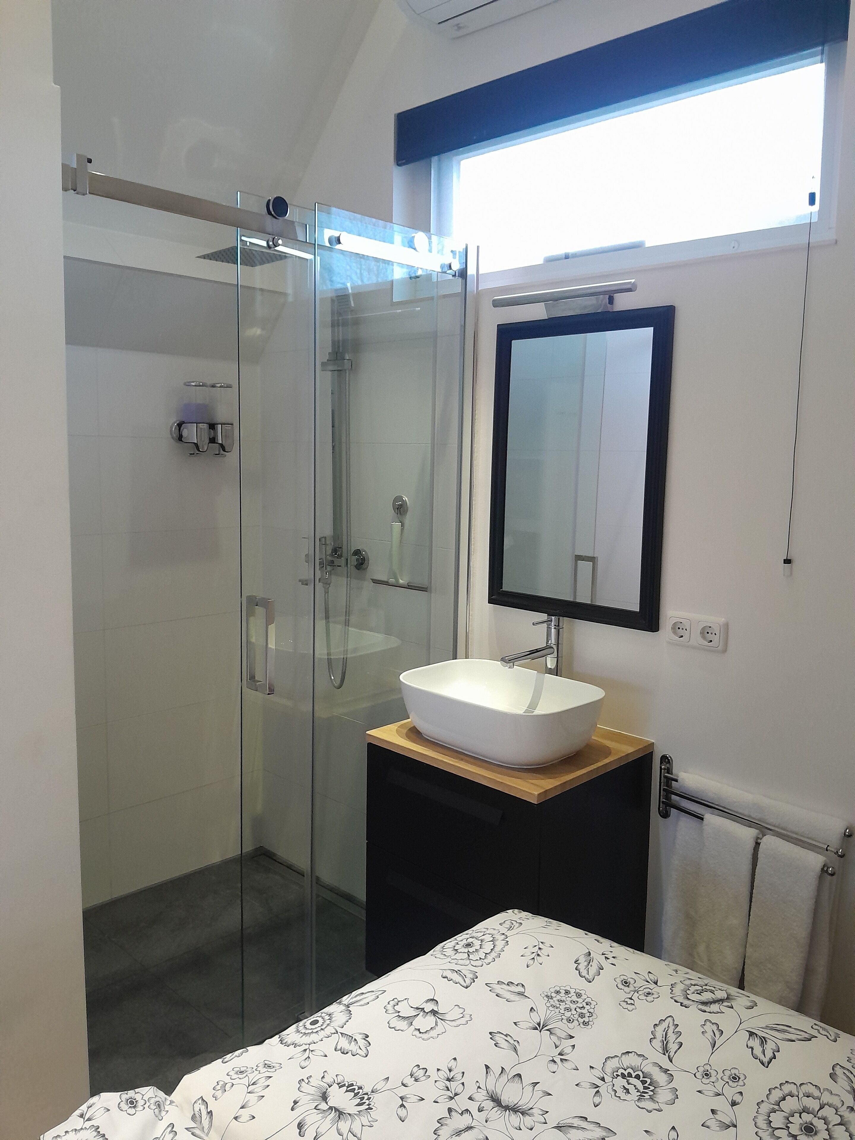 Shower, hair dryer, towels, soap