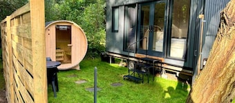 Charming tiny house by the lake with outdoor sauna