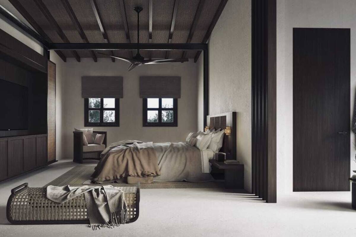 A modern bedroom with a bed, a chair, and a small table. There are two windows and a ceiling fan.