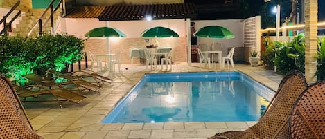 Outdoor pool, open 9:00 AM to 9:00 PM, pool umbrellas, pool loungers