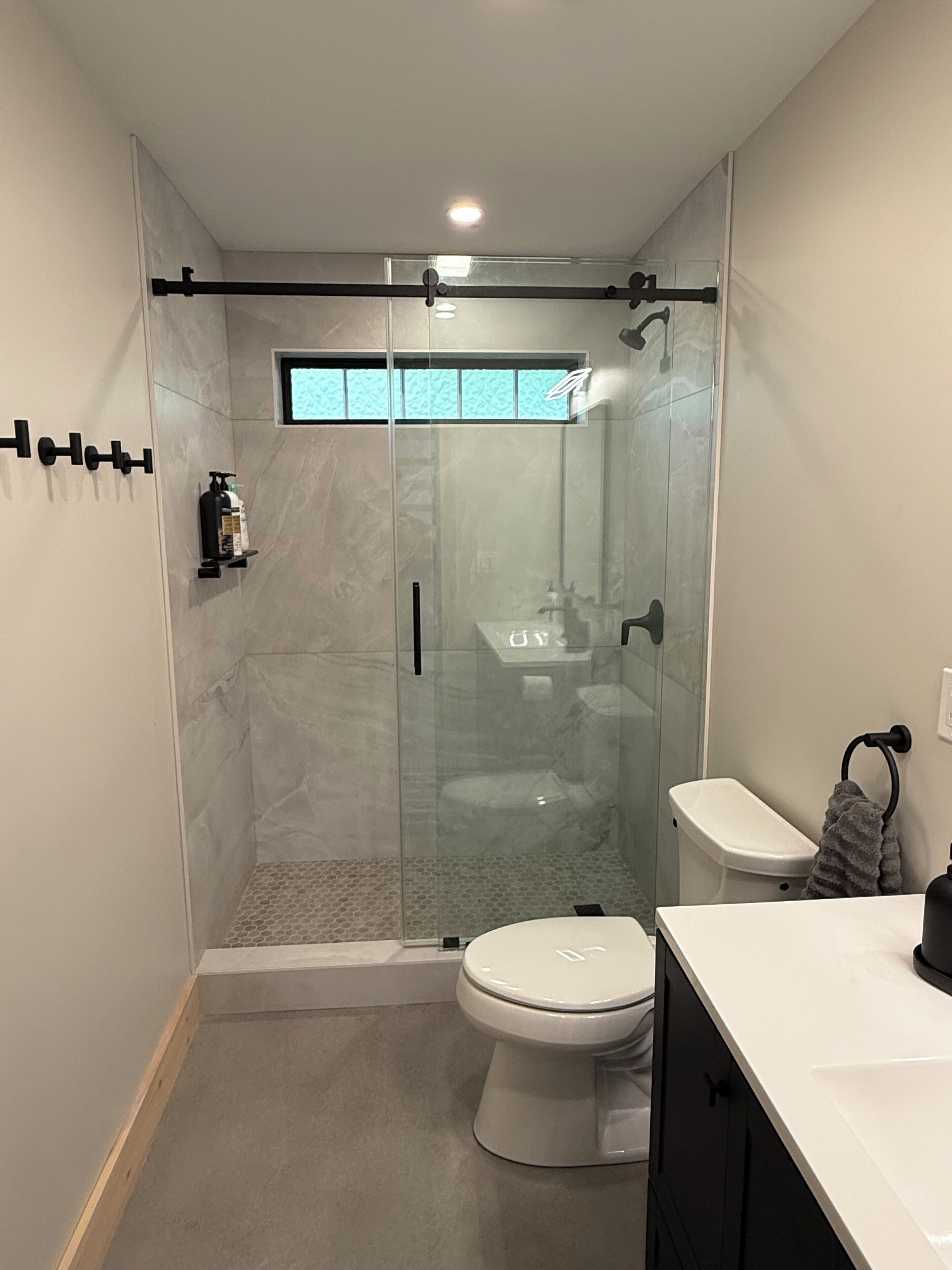 Shower, towels, soap, toilet paper