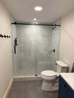 Shower, towels, soap, toilet paper