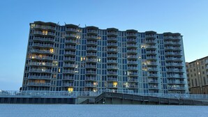 A high-rise building with multiple balconies and a waterfront view. - Welcome to your perfect beachfront condo in Daytona Beach Shores! (Daytona Beach Shores)