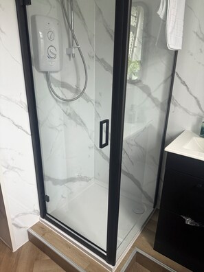 Shower, eco-friendly toiletries, hair dryer, towels