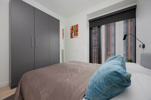 1 bedroom, desk, iron/ironing board, travel crib