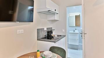 Fridge, stovetop, coffee/tea maker, cookware/dishes/utensils