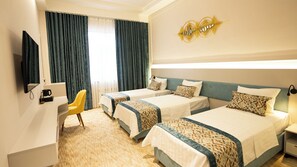 Deluxe Triple Room, Garden View | In-room safe, desk, laptop workspace, blackout drapes - COCO HOTEL (Tashkent)