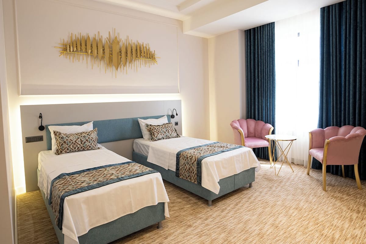 Luxury Double or Twin Room, City View | In-room safe, desk, laptop workspace, blackout drapes