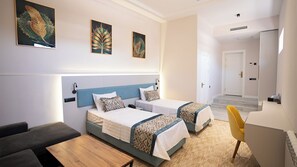 Family Room | In-room safe, desk, laptop workspace, blackout drapes