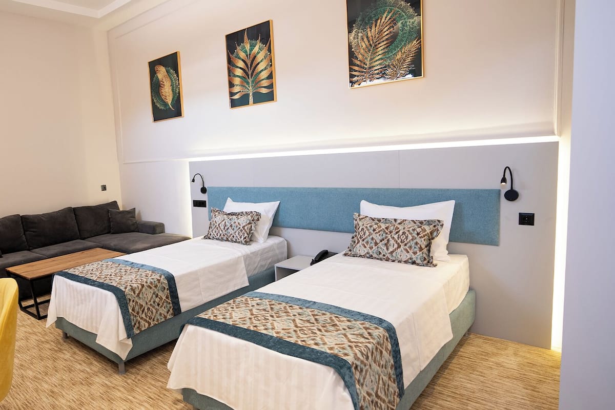 Family Room | In-room safe, desk, laptop workspace, blackout drapes