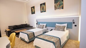 Family Room | In-room safe, desk, laptop workspace, blackout drapes