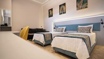 Family Room | In-room safe, desk, laptop workspace, blackout drapes