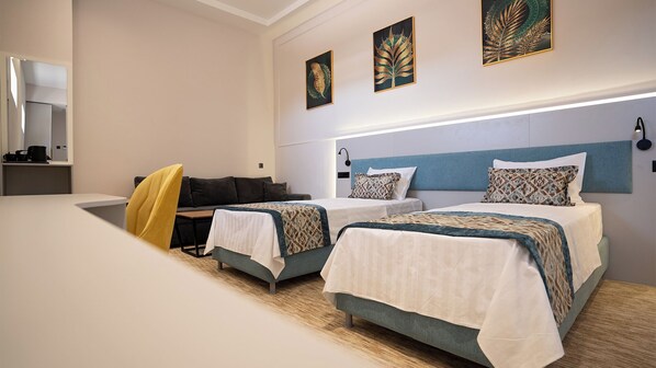 Family Room | In-room safe, desk, laptop workspace, blackout drapes