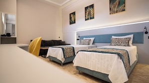 Family Room | In-room safe, desk, laptop workspace, blackout drapes