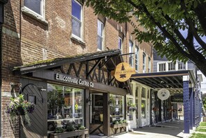 A storefront with a sign for 'Elicottville Coffee Co.' and 'Alpine Bistro.'