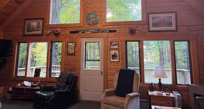 Rustic Forest Getaway has the comforts of home surrounded by woods and water.