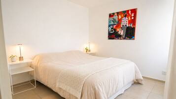 1 bedroom, desk, iron/ironing board, travel crib