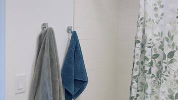 Hair dryer, towels, soap, shampoo