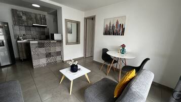 Family Apartment, 1 Bedroom, Air conditioning | Living area