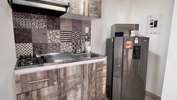 Fridge, microwave, stovetop, cookware/dishes/utensils