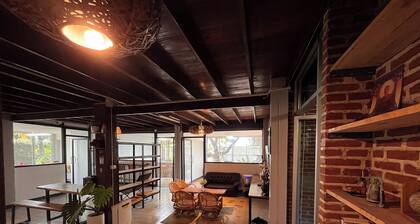 Bright and Cozy Bedroom with AC in a Stylish Thai House, Primary Location.