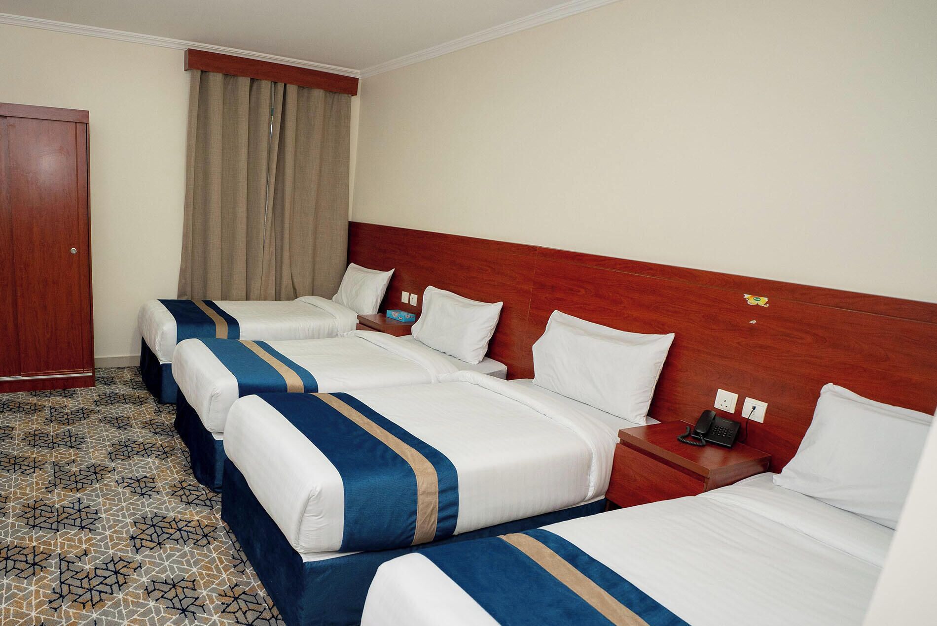 Comfort Quadruple Room, City View | In-room safe, desk, laptop workspace, blackout drapes