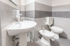 Hair dryer, bidet, towels, soap