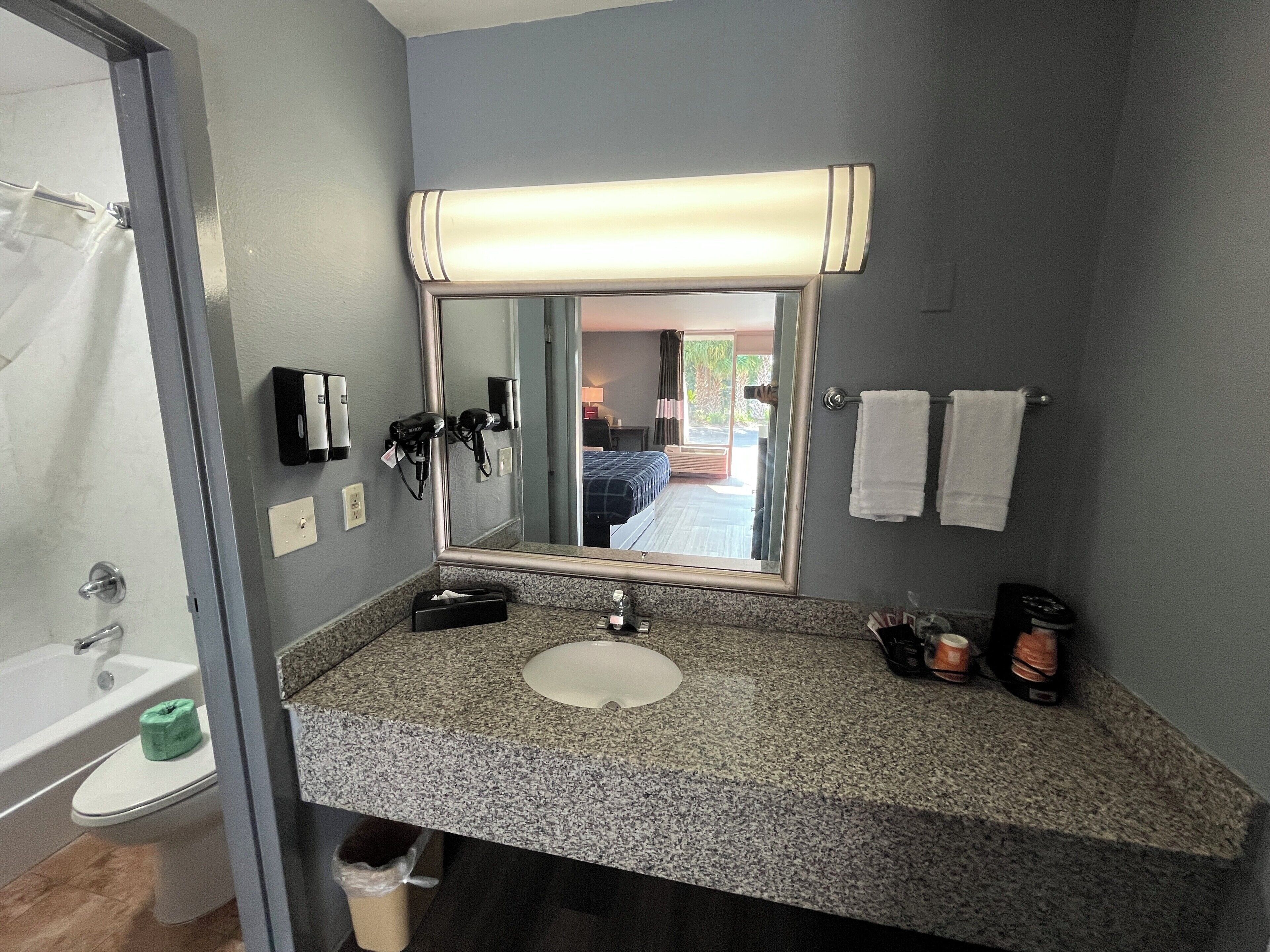 Bathtub, hair dryer, towels, soap