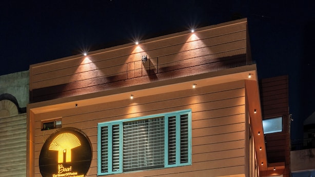 A hotel with a sign reading "The House of Peace" and a balcony with a view. - Baari the house fusion (Jaipur)