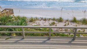 A wooden deck with a view of the beach and ocean. - Sea Dunes Green Turtle A3 (New Smyrna Beach)
