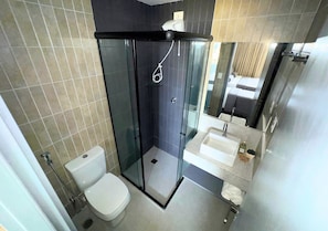 Suite, 1 Bedroom, Non Smoking, Air conditioning | Bathroom | Shower, hair dryer, soap, shampoo